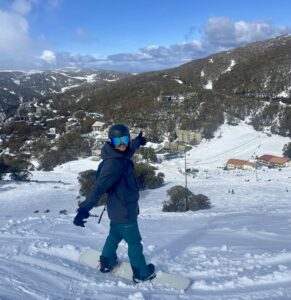Nic from WAM Wild Adventures Melbourne snowboarding the Victorian Alps